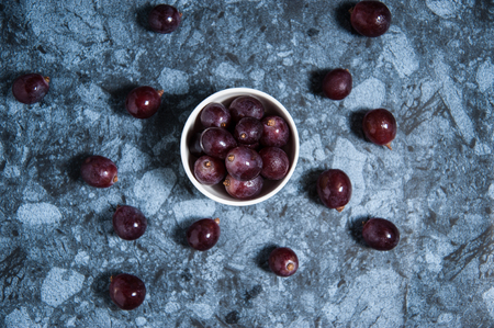 Fresh grape fruits on marble table. Flat lay.の写真素材
