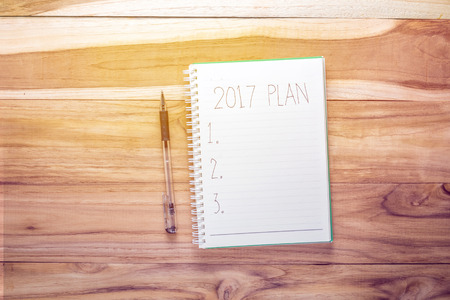 Top view notebook on wooden deskの写真素材