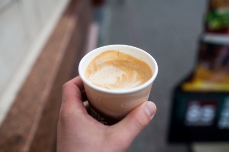 Cup of coffee in handの写真素材