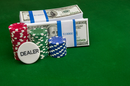 Stack of cash with poker chipsの写真素材