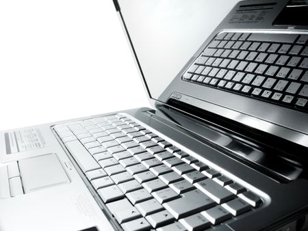 Keyboard of laptop computer self-reflected on the screen.の写真素材