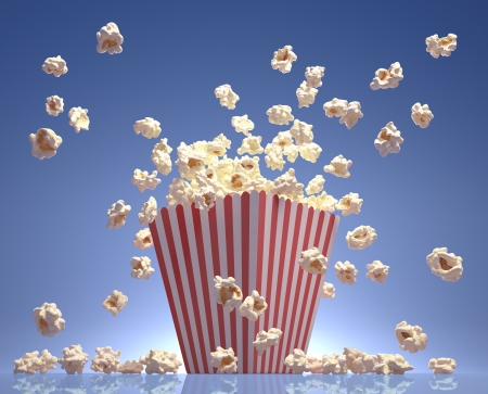 Popcorn exploding inside the packaging striped.の写真素材