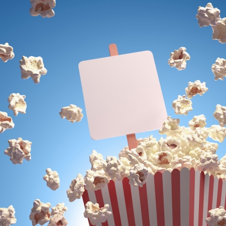 Popcorn exploding everywhere. Your text on the whiteboard.の写真素材