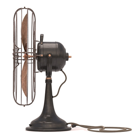 Antique and old fan isolated on the white の写真素材