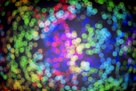 Blur of colored lights in the background. Depth of field out of focus.