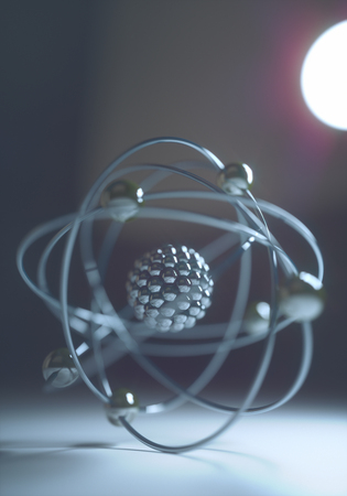 Atomic model in balance with backlight. Concept image of physics and chemistry.