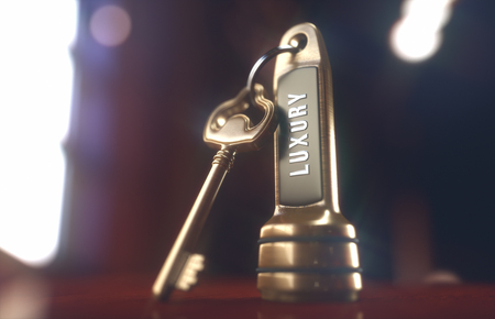 Luxury hotel key on the wooden table of the lobby service.の写真素材