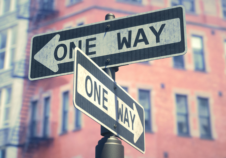 Conceptual image of one-way sign used on several streets on the USA.