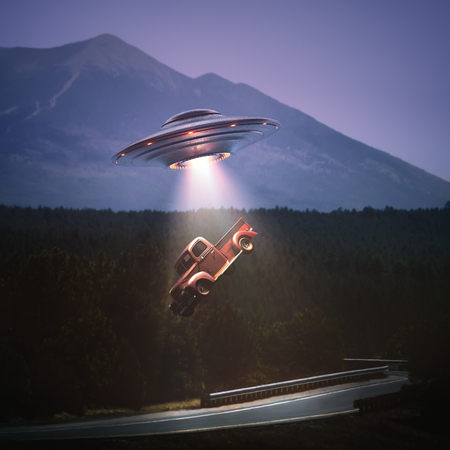 Unidentified flying object lifting a car from road. Concept of alien abduction. Clipping path included.の素材 [FY310115411471]