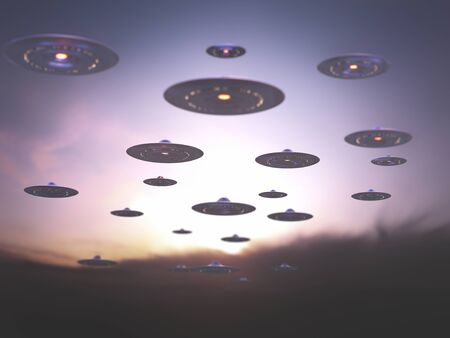 Invasion of alien spaceships under the sky at sunset.の写真素材