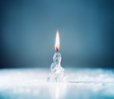 Candle on fire made of ice as opposed to flammable materials.の写真素材