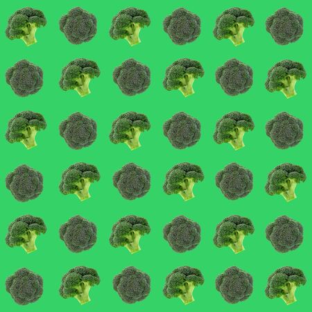 Broccoli vegetable pattern, isolated on green background.の写真素材