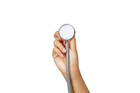 Female hand holding stethoscope isolated on white background, healthcare concept.の写真素材