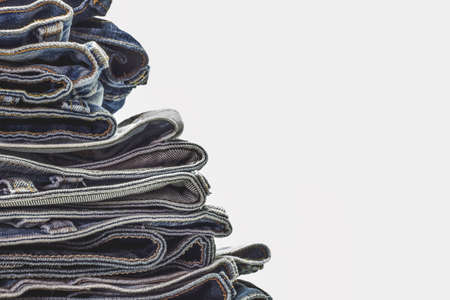 Stack of jeans, Fabric of Jeans denim texture background.