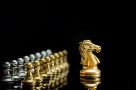Golden chess knight pieces playing game and strategy. Concept of leadership and successの写真素材