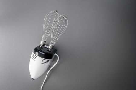 Hand mixer for cooking and bakery on gray background.の写真素材