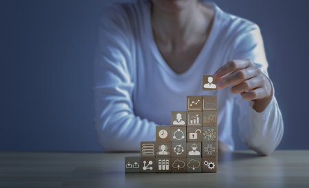 Concept of teamwork, strategy, vision, Businessmen planning business strategy by wooden blocks.の写真素材