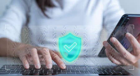 Woman hand enter a one time password for the validation process on laptop, Mobile OTP secure...