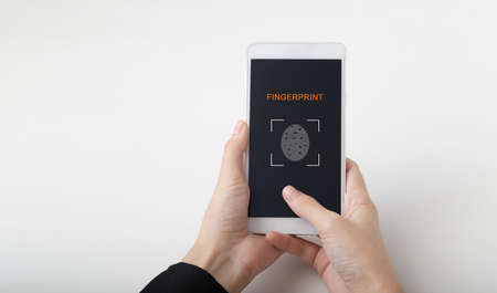 Female hand scanning fingerprint on smartphone screen, Unlock mobile phone, unlock the device, on...