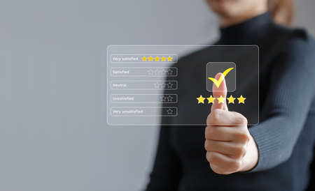 Customer review rating and satisfaction survey concept. Customer give thumbs up to the checkbox and...