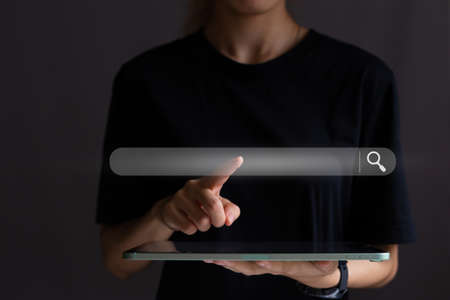 Search button on virtual screen pressed with finger, Concept for promoting ranking traffic on...