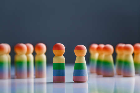 Wooden doll painted with rainbow flags. LGBT Rights concept.の写真素材
