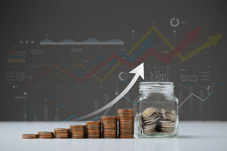 Stacks of coins and jars of coins for savings with chart on background. Concept of money savings ,...