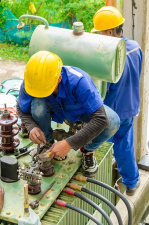 Nonthaburi, Thailand - September 28, 2015 : Electrician preparing an oil change a power transformer of condominium. This activity is according to the specified period.のeditorial素材
