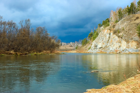 Rocky bank of the wild forest riverの写真素材