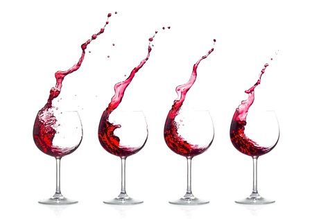 Splash red wine on white backgroundの写真素材