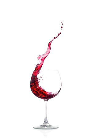 Splash red wine on white backgroundの写真素材