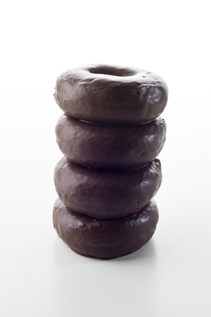 chocolate donuts isolated on white backgroundの写真素材