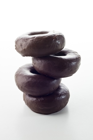 chocolate donuts isolated on white backgroundの写真素材