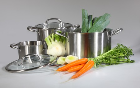 Stainless steel pots and pans isolated on gray background
の写真素材