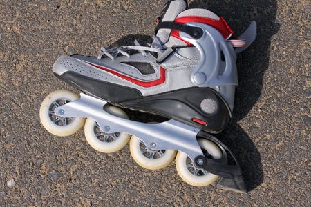 a close-up of silver and red rollerskates