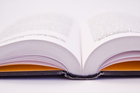 a close-up of open book on white background