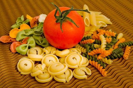 colorful pasta mix with tomatoeの写真素材