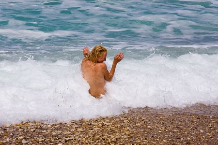 a beutiful woman on the beach in Mediterraneanの写真素材