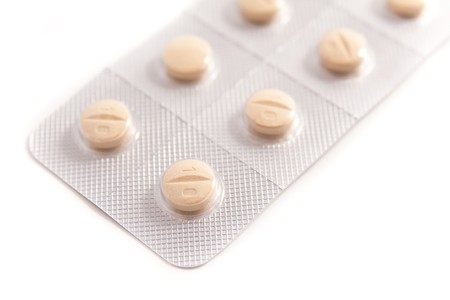 packs of medical pills on white background