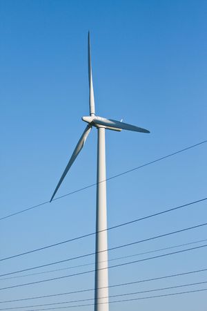 windmill together with high voltage powerlines