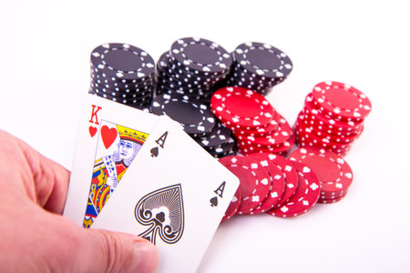 king of hearts and black jack with poker chips on white backgroundのeditorial素材