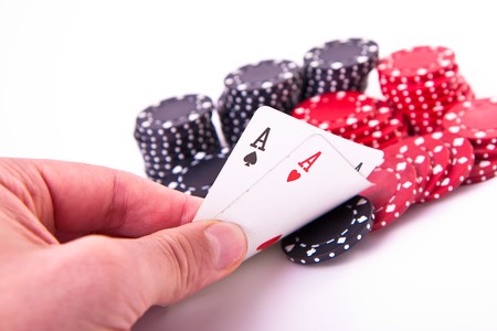 ace of hearts and black jack with poker chips on white backgroundの写真素材
