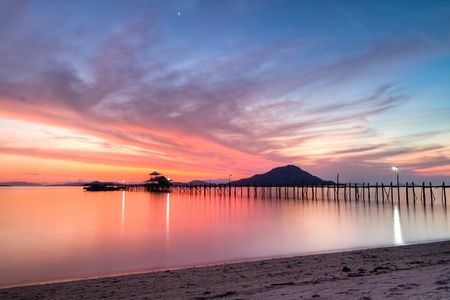 wooden pier on tropical Kanawa Island at duskの写真素材