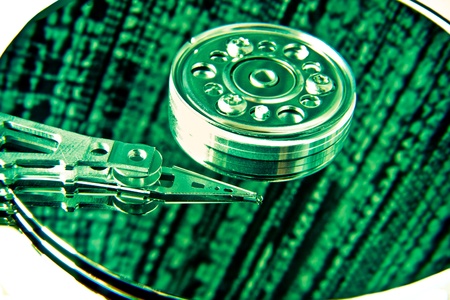 close up of hard disk with green abstract technology reflectionの写真素材