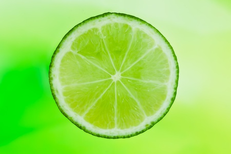 slice of lime in the waterの写真素材