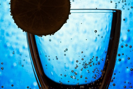 glass silhouette with lime and bubbles