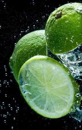 fruit splashing in the waterの写真素材