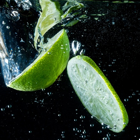 fruit splashing in the waterの写真素材