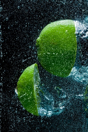 fruit splashing in the waterの写真素材