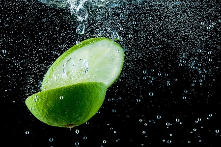 fruit splashing in the waterの写真素材